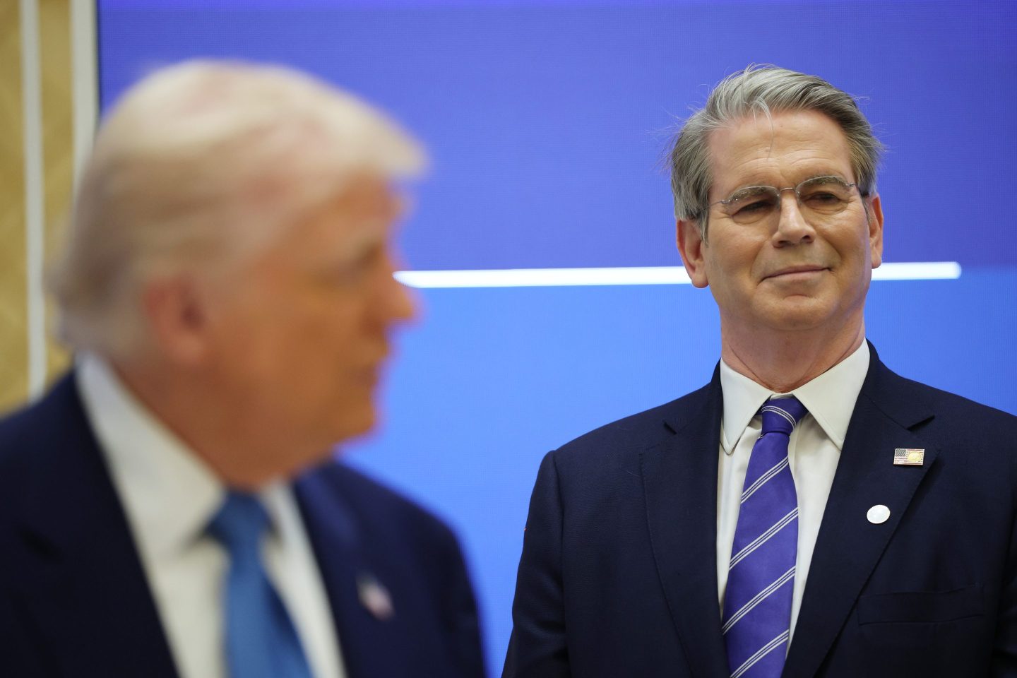 ABU DHABI, UNITED ARAB EMIRATES - MAY 16: U.S. President Donald J. Trump speaks during a US-UAE Investment Forum alongside U.S. Secretary of the Treasury, Scott Bessent (R) at Qasr al-Watan, presidential palace of the United Arab Emirates, on May 16, 2025, in Abu Dhabi, United Arab Emirates. Trump is on the fourth and final day of his visit to the Gulf to underscore the strategic partnership between the United States and regional allies including the UAE, focusing on security and economic collaboration. (Photo by Win McNamee/Getty Images)